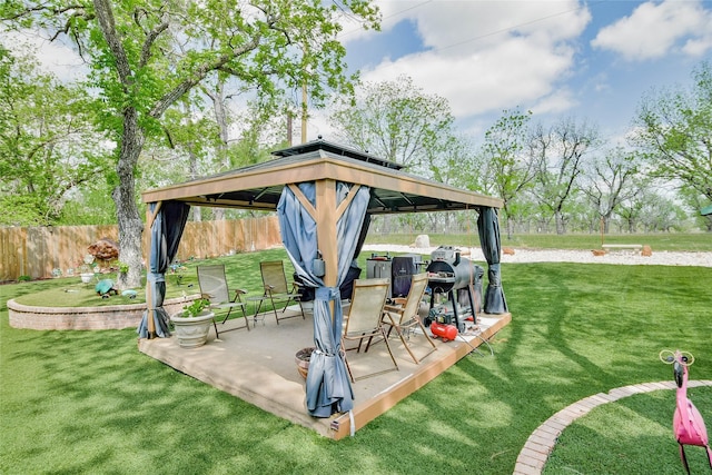 view of patio / terrace featuring fence and a gazebo