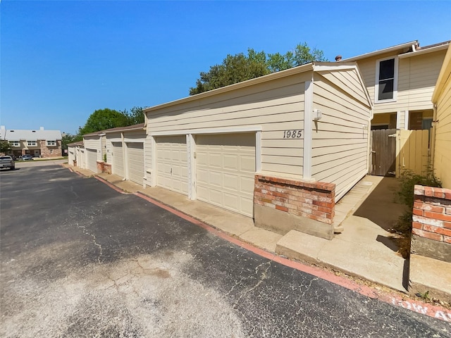 garage with fence