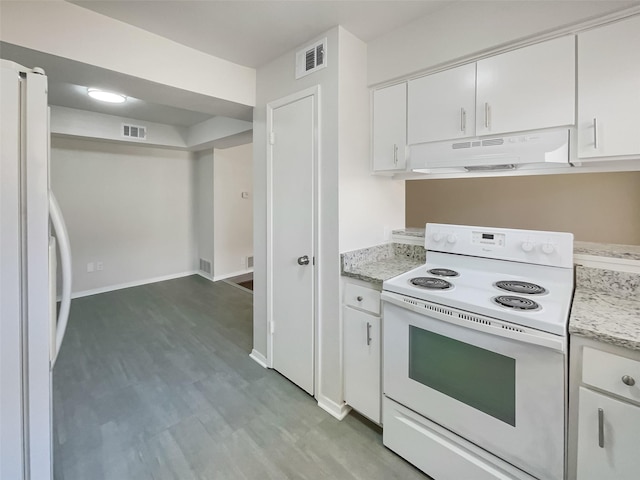kitchen with visible vents, under cabinet range hood, white appliances, and white cabinetry