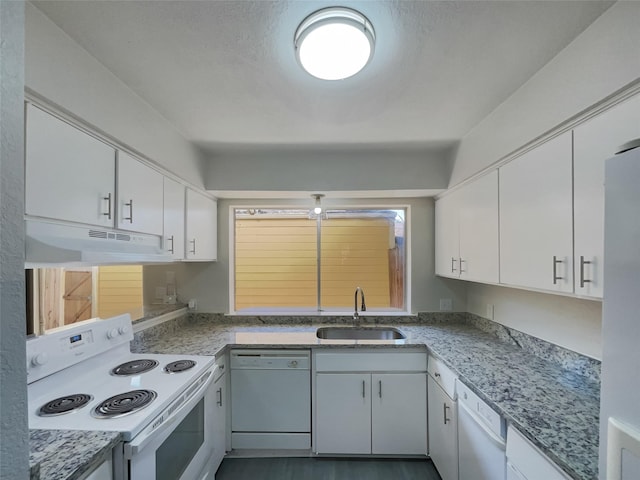 kitchen with under cabinet range hood, white appliances, a sink, and white cabinetry