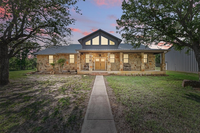 1350 Bennett Rd, Millsap, TX 76066 - rear view of property featuring stone siding, a porch, and metal roof