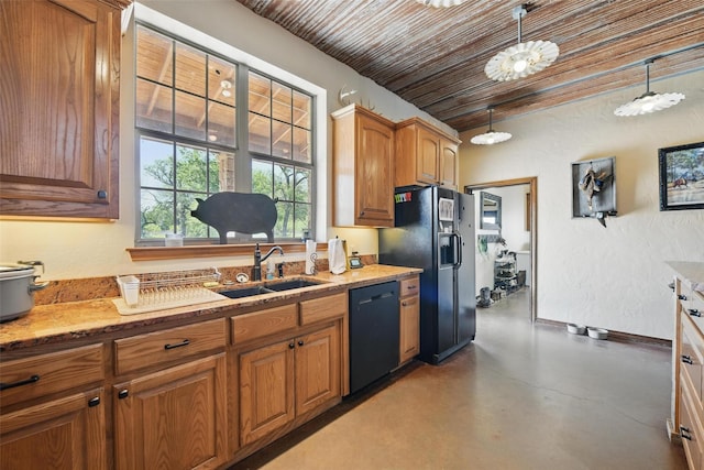 1350 Bennett Rd, Millsap, TX 76066 - kitchen featuring brown cabinets, a sink, light stone countertops, finished concrete floors, and black appliances