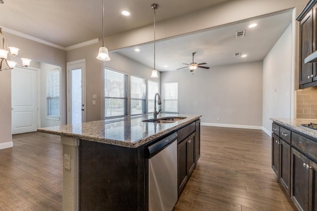 kitchen featuring dark brown cabinets, dishwasher, visible vents, and a sink