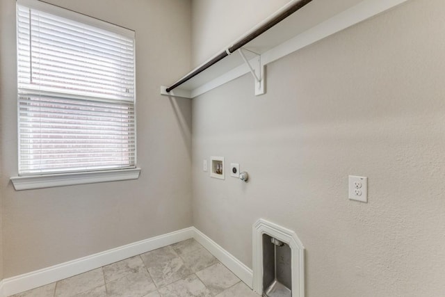 laundry room with marble finish floor, laundry area, gas dryer hookup, hookup for a washing machine, and baseboards