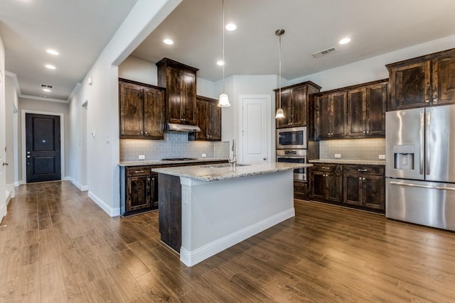 kitchen with a sink, dark brown cabinetry, appliances with stainless steel finishes, under cabinet range hood, and visible vents