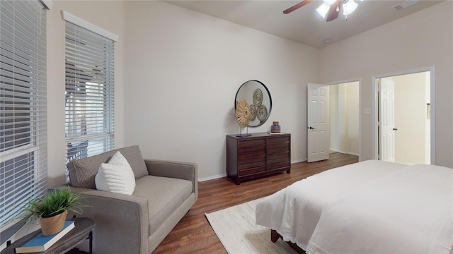 bedroom featuring baseboards, a ceiling fan, and wood finished floors