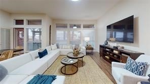sunken living room featuring wood finished floors