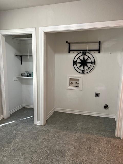laundry room featuring electric dryer hookup, dark colored carpet, laundry area, and baseboards