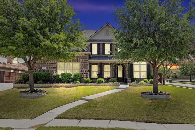 1300 Brittany Way, Prosper, TX 75078 - view of front of property with brick siding, board and batten siding, a lawn, and fence
