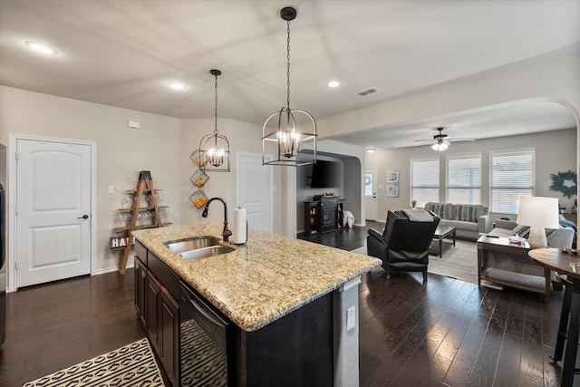 14116 Rabbit Brush Ln, Fort Worth, TX 76052 - kitchen with arched walkways, dishwasher, dark wood-type flooring, and a sink