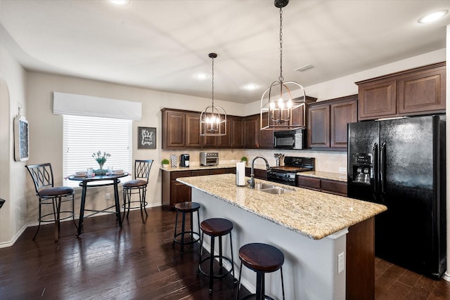 14116 Rabbit Brush Ln, Fort Worth, TX 76052 - kitchen featuring a sink, dark brown cabinets, visible vents, dark wood-type flooring, and black appliances