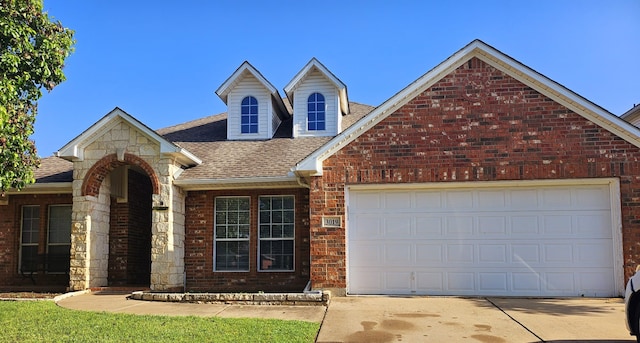 3019 Stallion Xing, Irving, TX 75060 - view of front of house with a garage, driveway, a shingled roof, a front yard, and brick siding
