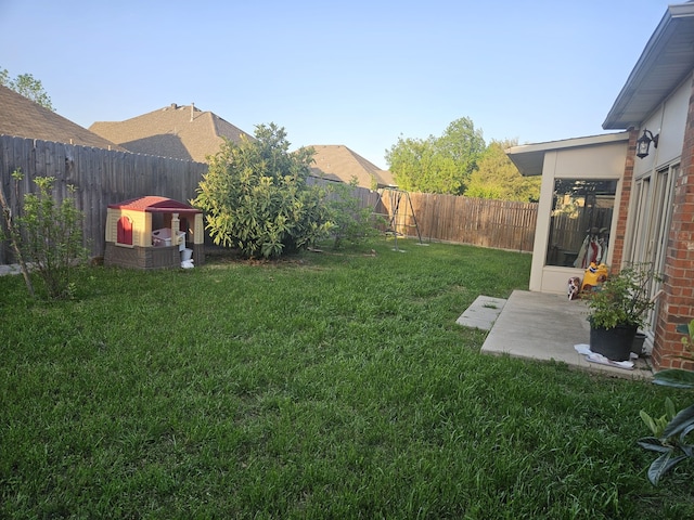 3019 Stallion Xing, Irving, TX 75060 - rear view of property featuring fence, a yard, roof with shingles, brick siding, and a sunroom