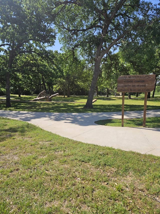 3019 Stallion Xing, Irving, TX 75060 - view of community with playground community, a lawn, and fence