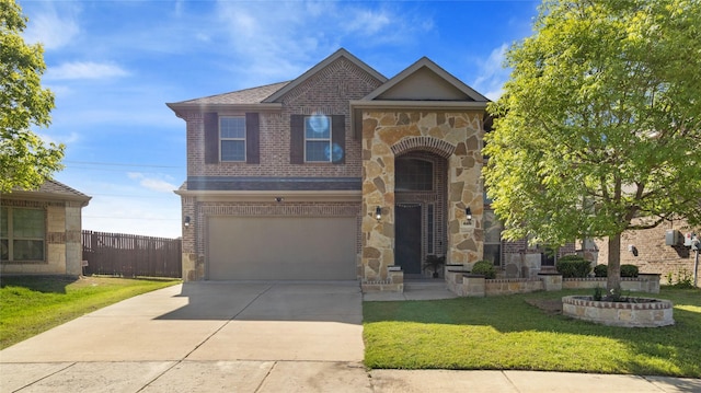 traditional-style home with brick siding, stone siding, a front lawn, and a garage