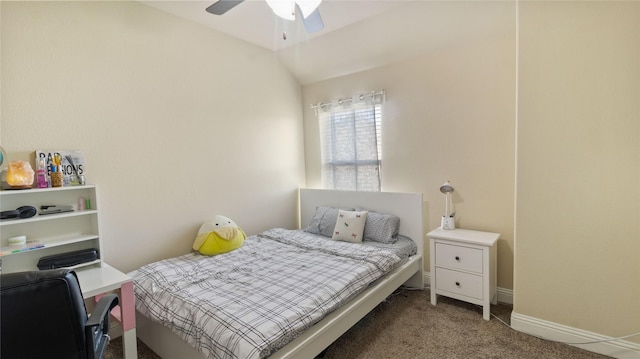 carpeted bedroom with lofted ceiling, baseboards, and ceiling fan