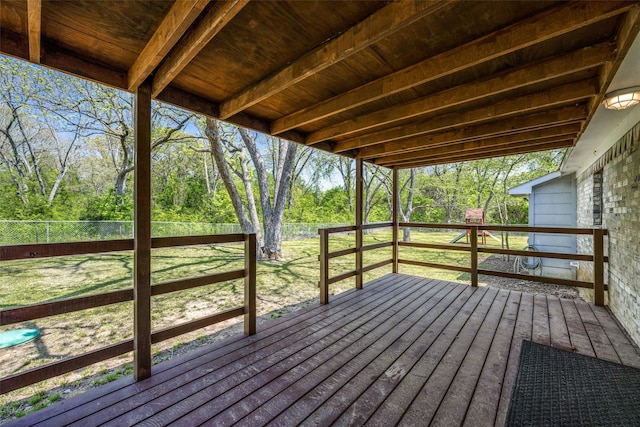 deck featuring a lawn and a fenced backyard