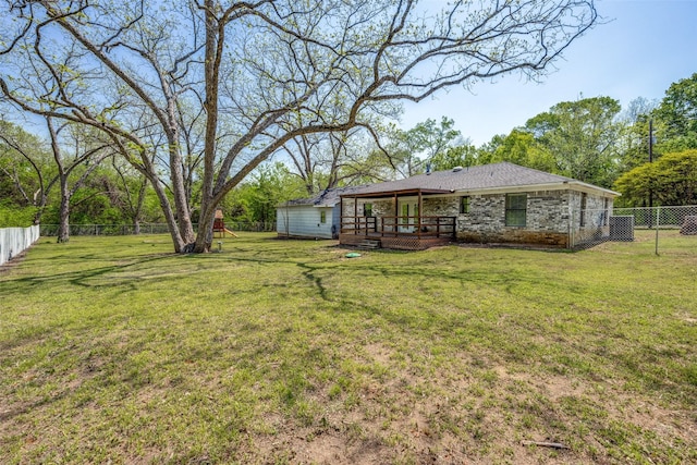 view of yard with a fenced backyard, a wooden deck, and central air condition unit