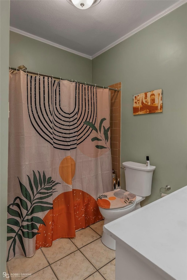 bathroom featuring crown molding, vanity, toilet, and tile patterned floors