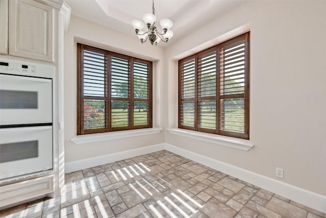 1281 Vz County Road 2120, Canton, TX 75103 - unfurnished dining area with brick floor, baseboards, and a notable chandelier