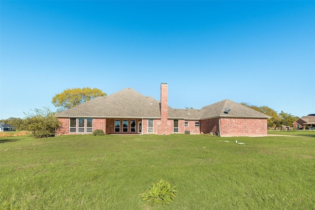 1281 Vz County Road 2120, Canton, TX 75103 - back of property with a chimney, brick siding, and a yard