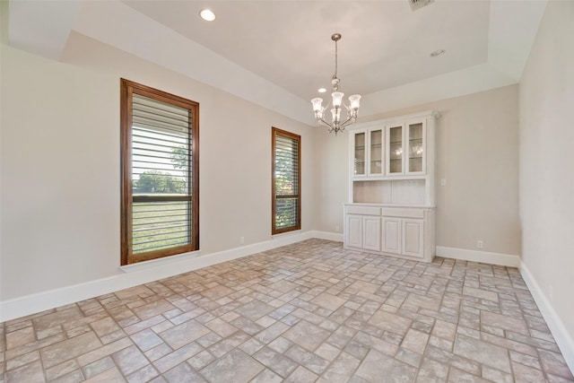 1281 Vz County Road 2120, Canton, TX 75103 - unfurnished room with brick floor, baseboards, an inviting chandelier, and a tray ceiling