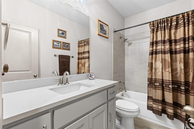 bathroom featuring vanity, shower / bathtub combination with curtain, and toilet
