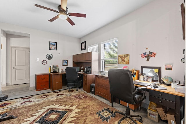 office space featuring a ceiling fan