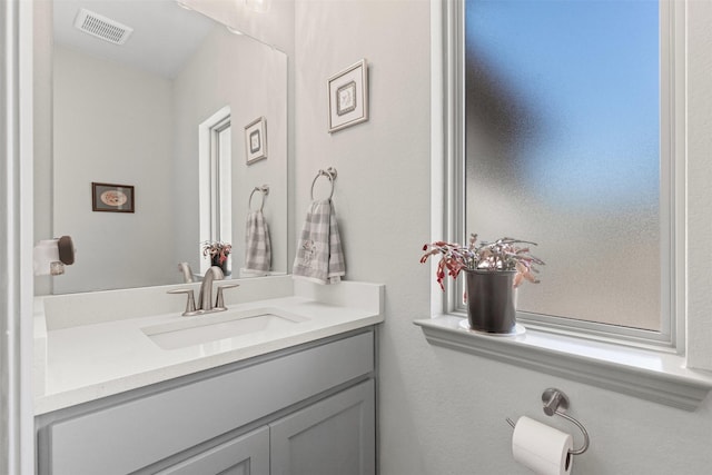 bathroom featuring visible vents and vanity
