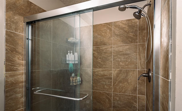 full bath featuring a shower stall