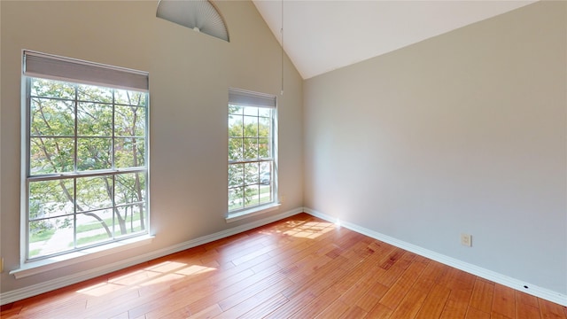 6926 Wickliff Trl, Plano, TX 75023 - empty room with light wood-style flooring, baseboards, and vaulted ceiling