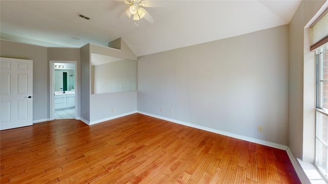 6926 Wickliff Trl, Plano, TX 75023 - unfurnished room featuring a ceiling fan, vaulted ceiling, light wood-style flooring, baseboards, and a sink