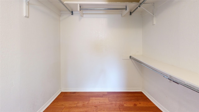 6926 Wickliff Trl, Plano, TX 75023 - walk in closet with light wood finished floors