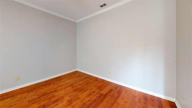 6926 Wickliff Trl, Plano, TX 75023 - empty room with baseboards, ornamental molding, and light wood-style flooring