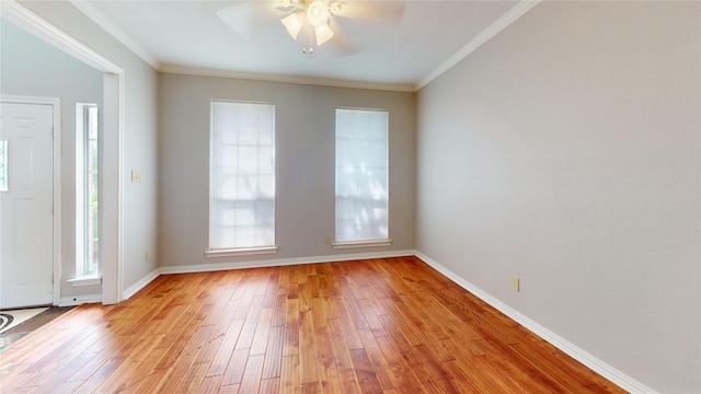 6926 Wickliff Trl, Plano, TX 75023 - unfurnished room with plenty of natural light, a ceiling fan, light wood-style floors, and crown molding