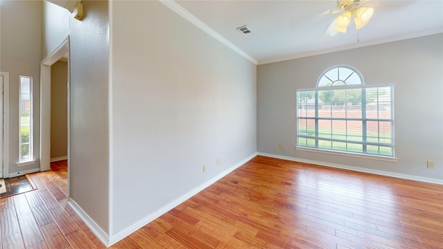 6926 Wickliff Trl, Plano, TX 75023 - spare room with light wood-style floors, ceiling fan, baseboards, and crown molding