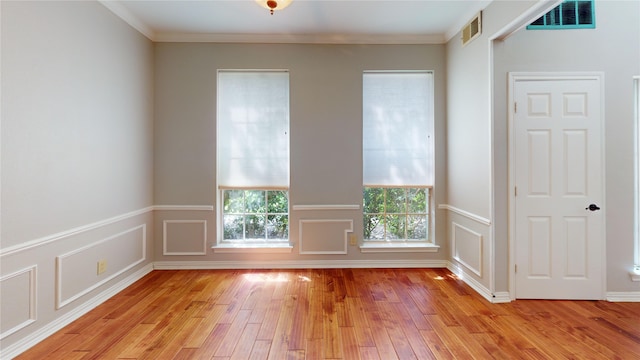 6926 Wickliff Trl, Plano, TX 75023 - unfurnished room with plenty of natural light, light wood-type flooring, and ornamental molding