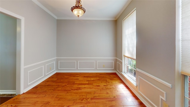 6926 Wickliff Trl, Plano, TX 75023 - unfurnished room featuring wood finished floors, ornamental molding, and wainscoting