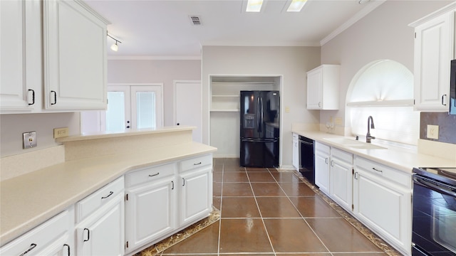 6926 Wickliff Trl, Plano, TX 75023 - kitchen with black appliances, a sink, white cabinets, and ornamental molding
