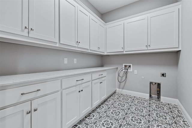 clothes washing area featuring hookup for an electric dryer, baseboards, washer hookup, hookup for a gas dryer, and cabinet space