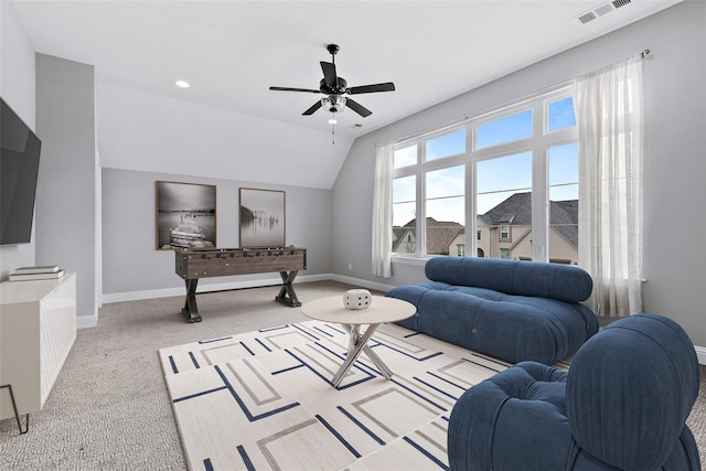 carpeted living area featuring recessed lighting, vaulted ceiling, visible vents, a ceiling fan, and baseboards