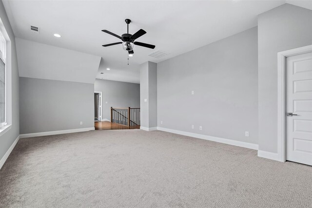 carpeted empty room with ceiling fan, baseboards, visible vents, and recessed lighting