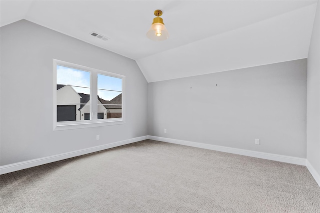bonus room featuring vaulted ceiling, visible vents, and carpet
