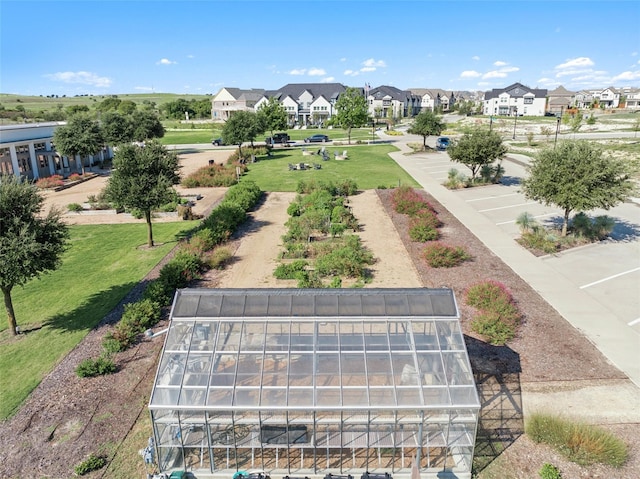 birds eye view of property with a residential view