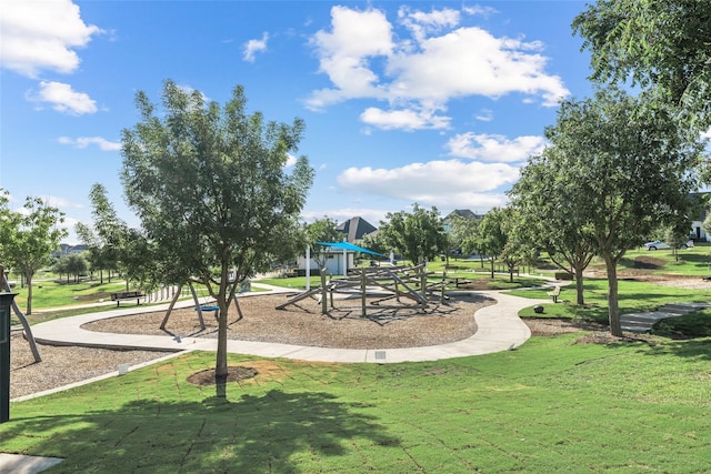 communal playground featuring a lawn