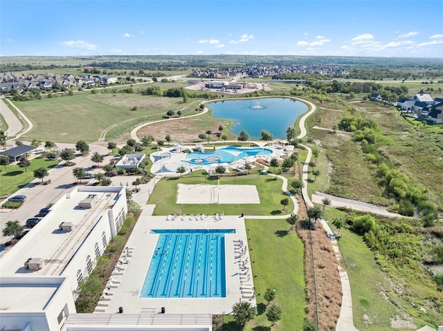 birds eye view of property with a water view