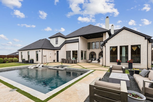 1501 Latigo Ct, Prosper, TX 75078 - back of property with outdoor lounge area, a patio area, brick siding, and a chimney
