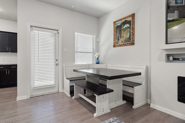 4652 Raleigh Dalton Rd, Dallas, TX 75227 - dining area with baseboards and light wood-style flooring