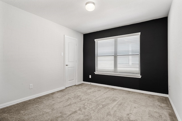 4652 Raleigh Dalton Rd, Dallas, TX 75227 - spare room featuring carpet floors and baseboards