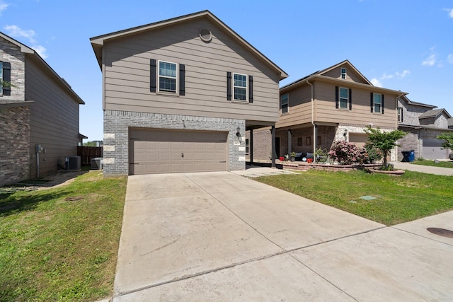 4652 Raleigh Dalton Rd, Dallas, TX 75227 - traditional home featuring concrete driveway, central AC unit, a front yard, and a garage